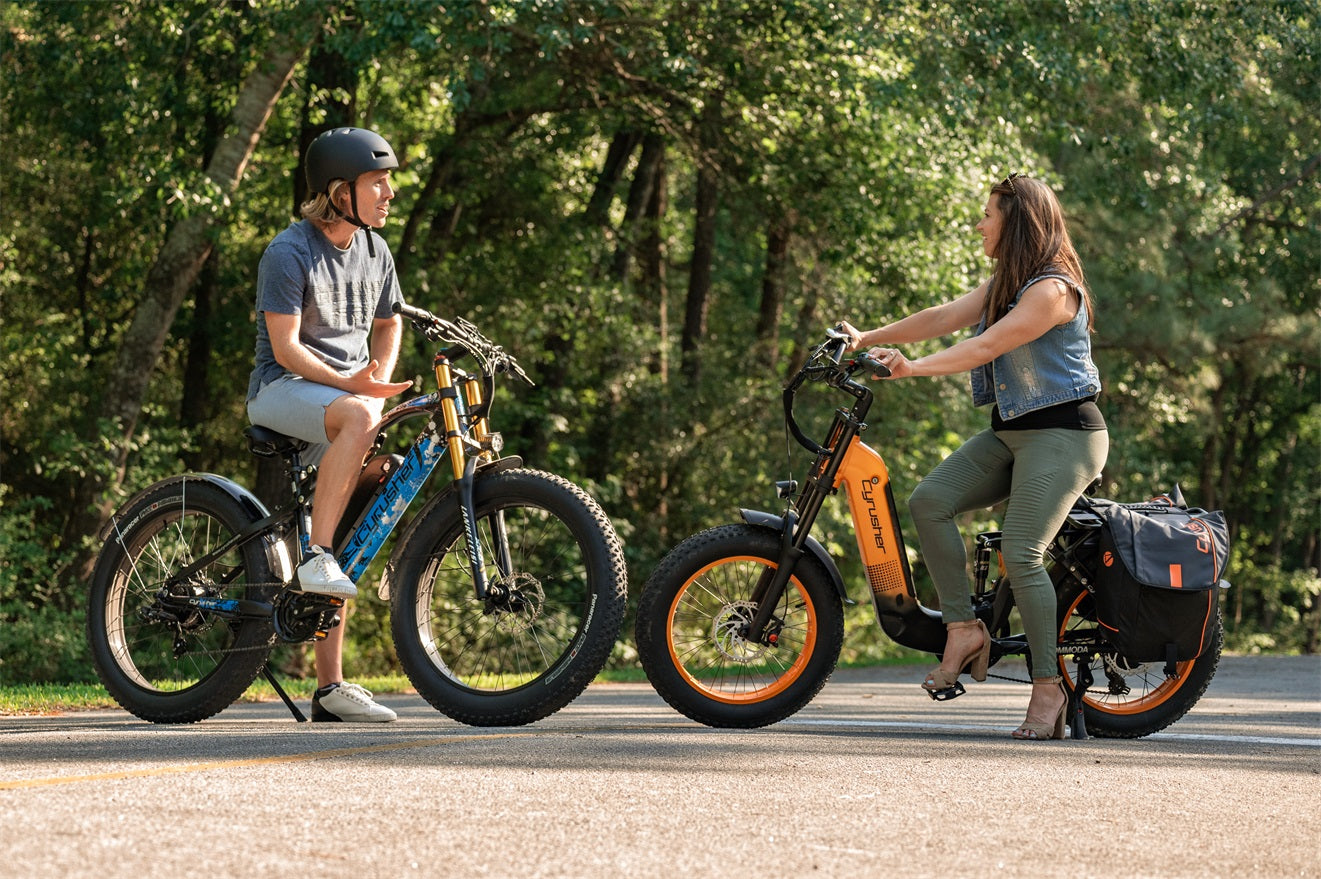 couple riding ebikes on road