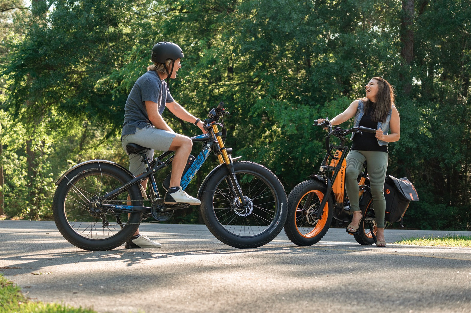 A man and woman ride electric bicycles.-1107