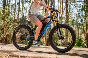 A man rides an electeic bike in the mountains.-0826