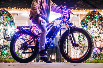 A man rides a decorated electric bike