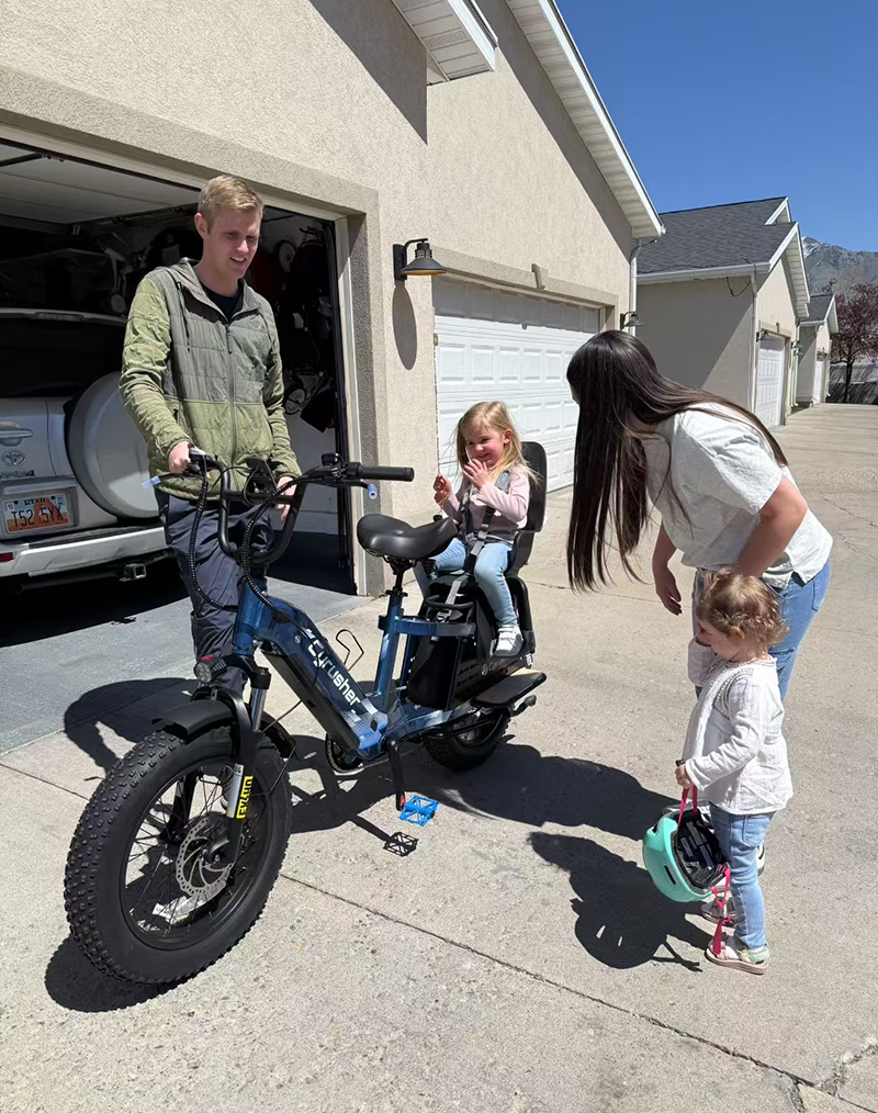 Family laughing and riding bikes together